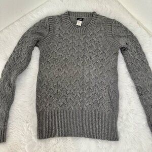 J.Crew women’s cable-knit sweater in a classic gray shade.